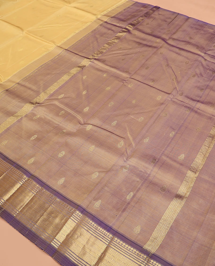 Sandal zari buttas Kanchipuram silk saree, contrast one-sided border of paneer sombu, banaras, muthu and then kuli kann designs, and pallu of zari designs