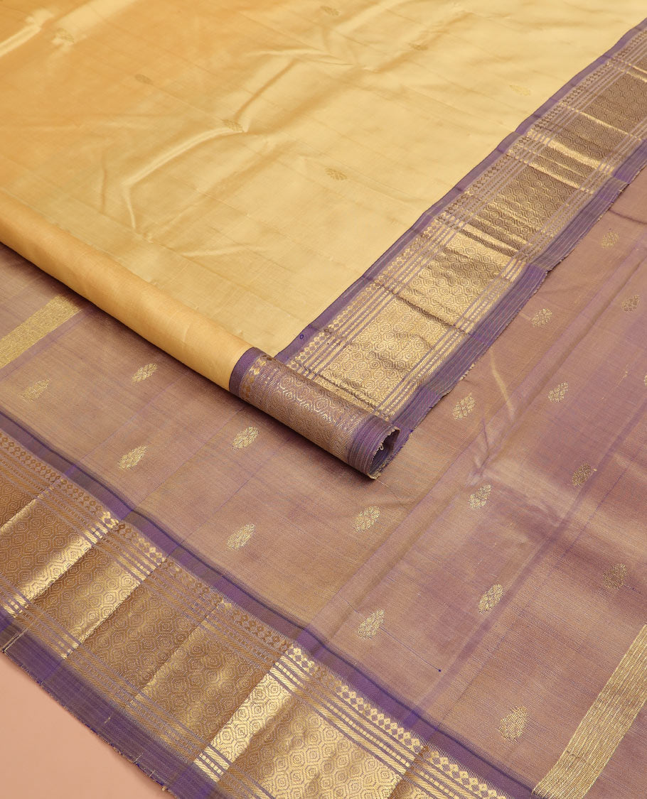 Sandal zari buttas Kanchipuram silk saree, contrast one-sided border of paneer sombu, banaras, muthu and then kuli kann designs, and pallu of zari designs