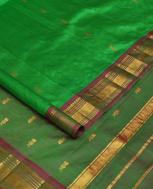 Green zari buttas Kanchipuram silk saree, contrast one-sided border of thilakam mokku,muthu & jaal & zari design pallu