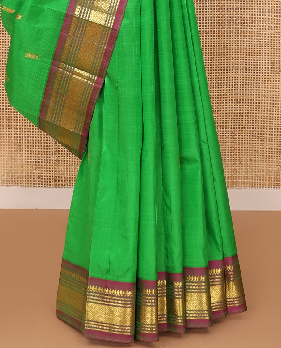 Green zari buttas Kanchipuram silk saree, contrast one-sided border of thilakam mokku,muthu & jaal & zari design pallu