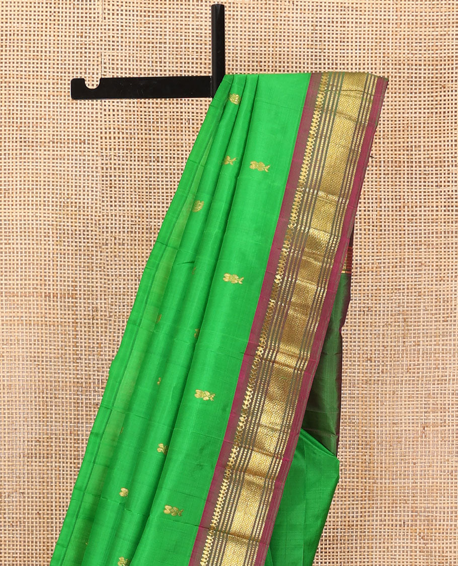 Green zari buttas Kanchipuram silk saree, contrast one-sided border of thilakam mokku,muthu & jaal & zari design pallu