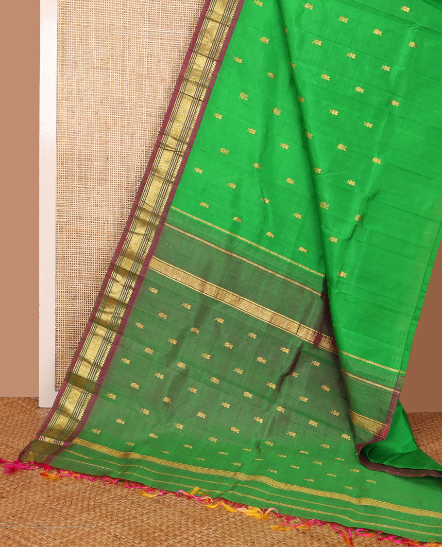 Green zari buttas Kanchipuram silk saree, contrast one-sided border of thilakam mokku,muthu & jaal & zari design pallu