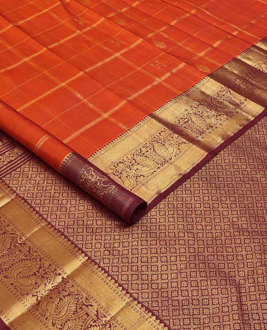 Orange zari buttas and checked Kanchipuram silk saree,contrast border of thilakam,banaras and mayil designs, and jaal pallu