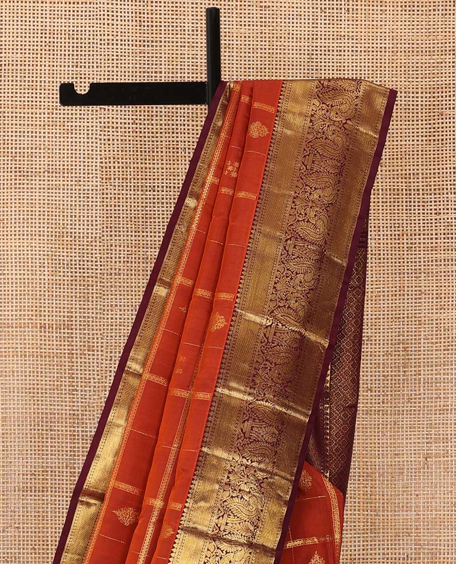 Orange zari buttas and checked Kanchipuram silk saree,contrast border of thilakam,banaras and mayil designs, and jaal pallu