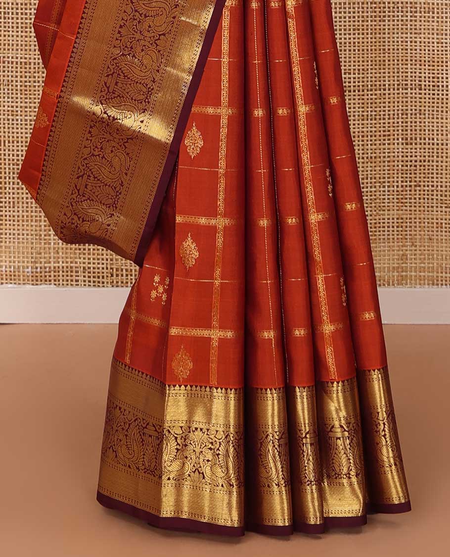 Orange zari buttas and checked Kanchipuram silk saree,contrast border of thilakam,banaras and mayil designs, and jaal pallu