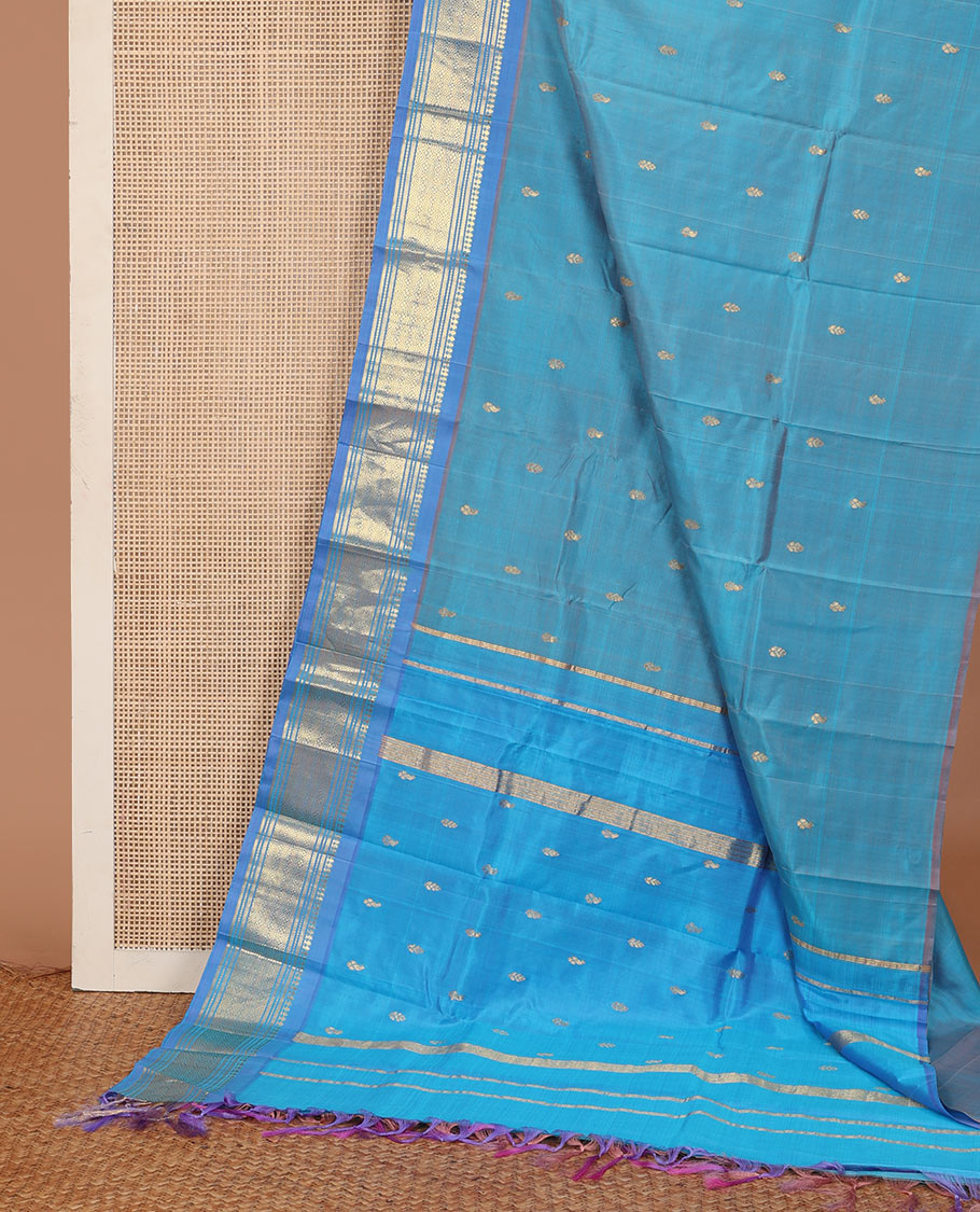 Blue zari buttas Kanchipuram silk saree, contrast one-sided border of panner sombu, muthu, banaras, and jaal, and zari woven pallu