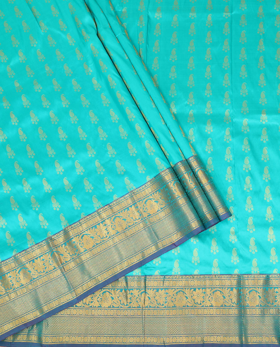 Blue zari buttas pure-silk half-saree with contrast border of laddu kamalam, kodi visiry, and mayil kann designs, contrast zari bordered blouse, and jaal design dhavani