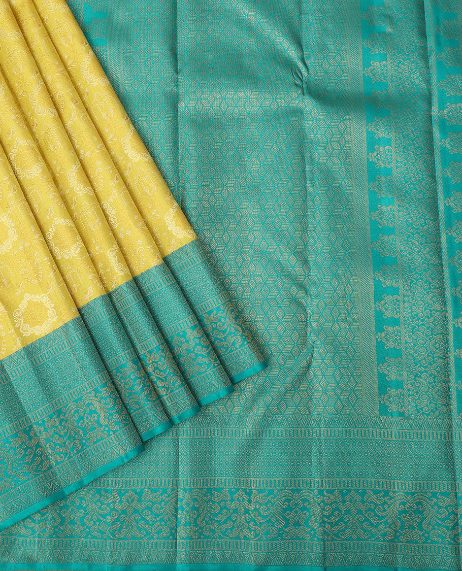 Yellow jacquard silk saree, contrast geometric patterned zari border & argyle patterned pallu