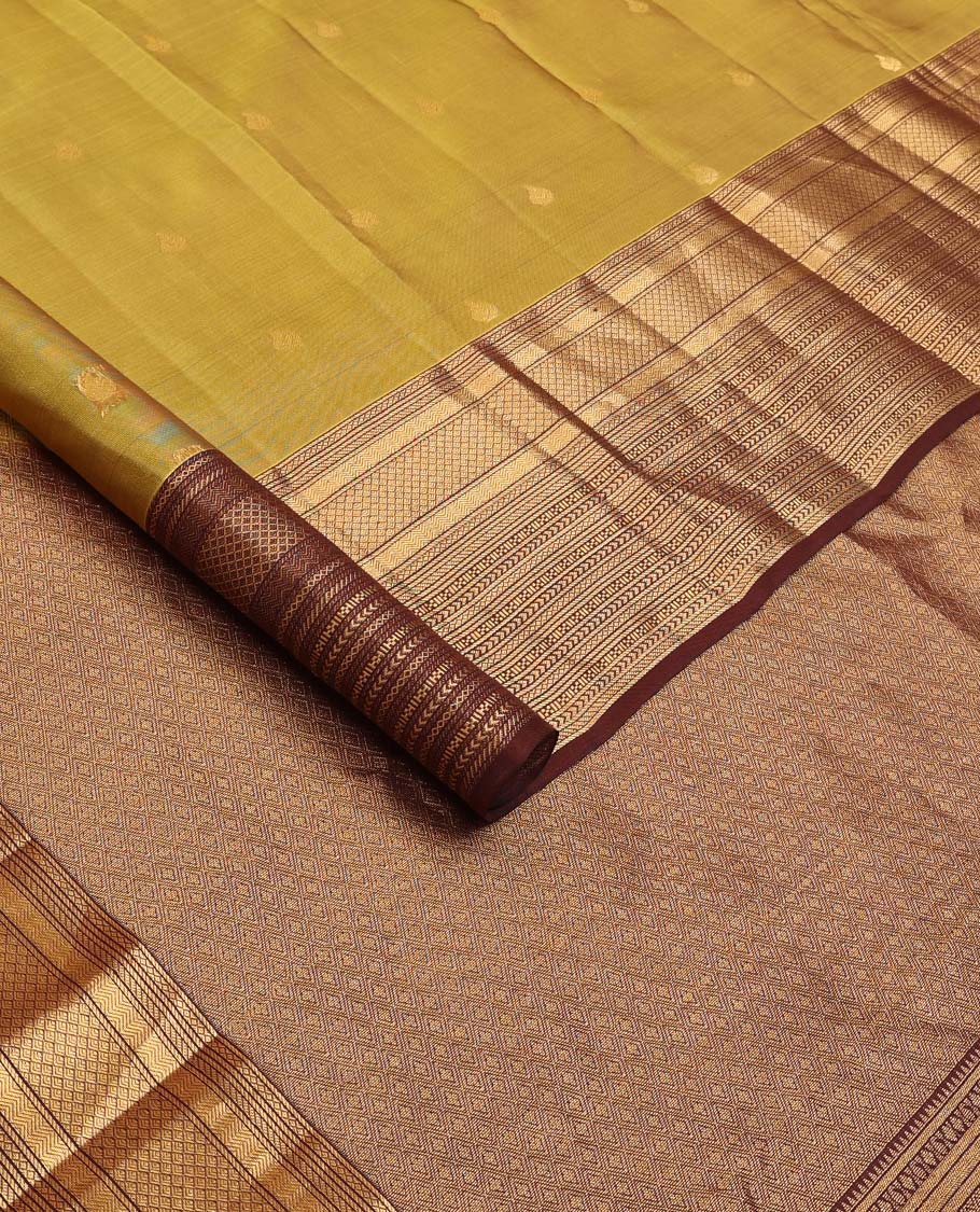 Green zari buttas Vasundhara silk mix saree, contrast border of vanki, jaal, mayil kann, banaras, kathir, and zari designs, and jaal pallu