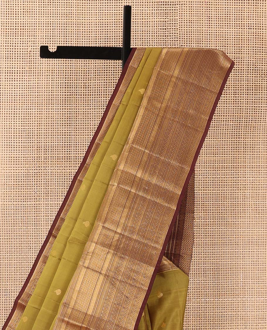 Green zari buttas Vasundhara silk mix saree, contrast border of vanki, jaal, mayil kann, banaras, kathir, and zari designs, and jaal pallu