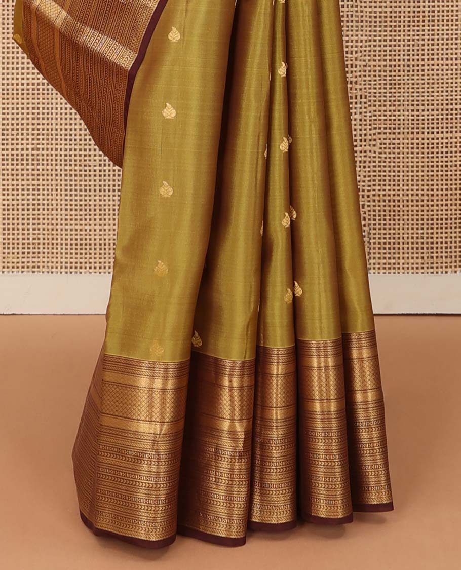 Green zari buttas Vasundhara silk mix saree, contrast border of vanki, jaal, mayil kann, banaras, kathir, and zari designs, and jaal pallu