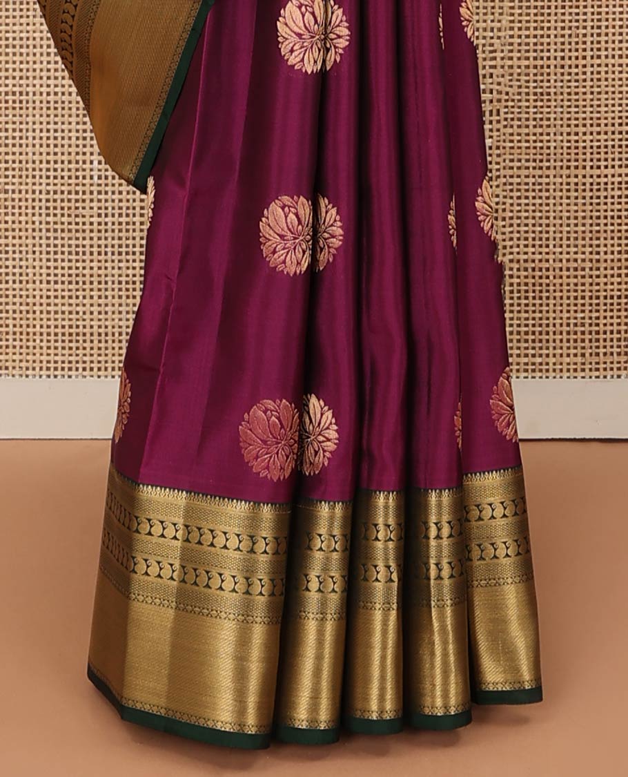 Magenta zari buttas Vasundhara silk mix saree, contrast border of thilakam, mayil kann, diamond, and manga designs, and geometric patterned pallu