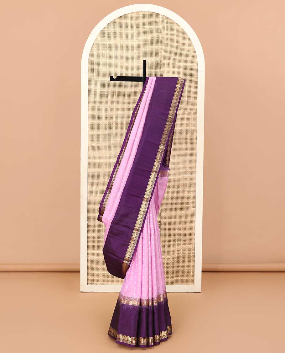 Pink buttas Kanchipuram silk saree, contrast border of rekku, banaras, muthu, and laddu kamalam, and jaal pallu