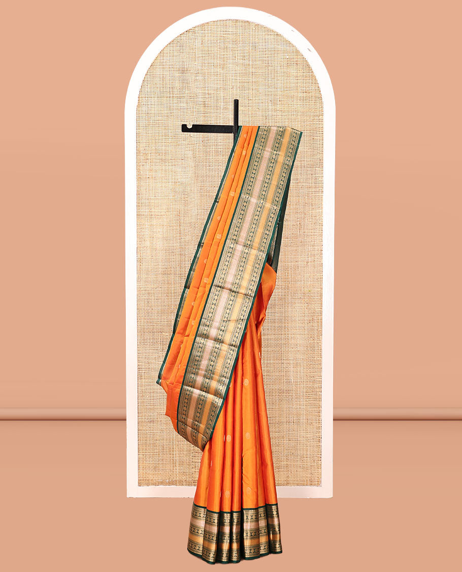 Orange Vasundhara Silk Saree, Woven with Zari Buttas, Contrast Border of Thilakam Mokku, Neli, Muthu, Kuyil Kann, Rudraksham, and Star Vanki, Grand Pallu, and a Contrast Blouse