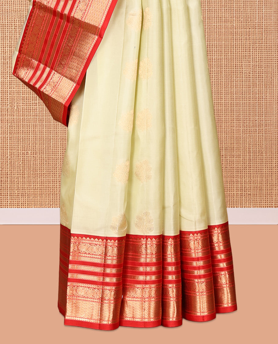 Pale Green Vasundhara Silk Saree,Sparsely Woven with Zari Buttas, Contrast Border of Thilakam Mokku, Kodi Visiry, Muthu, Mayil Kann, Mayil, and Kodi Visiry, Grand Pallu, and Contrast Blouse