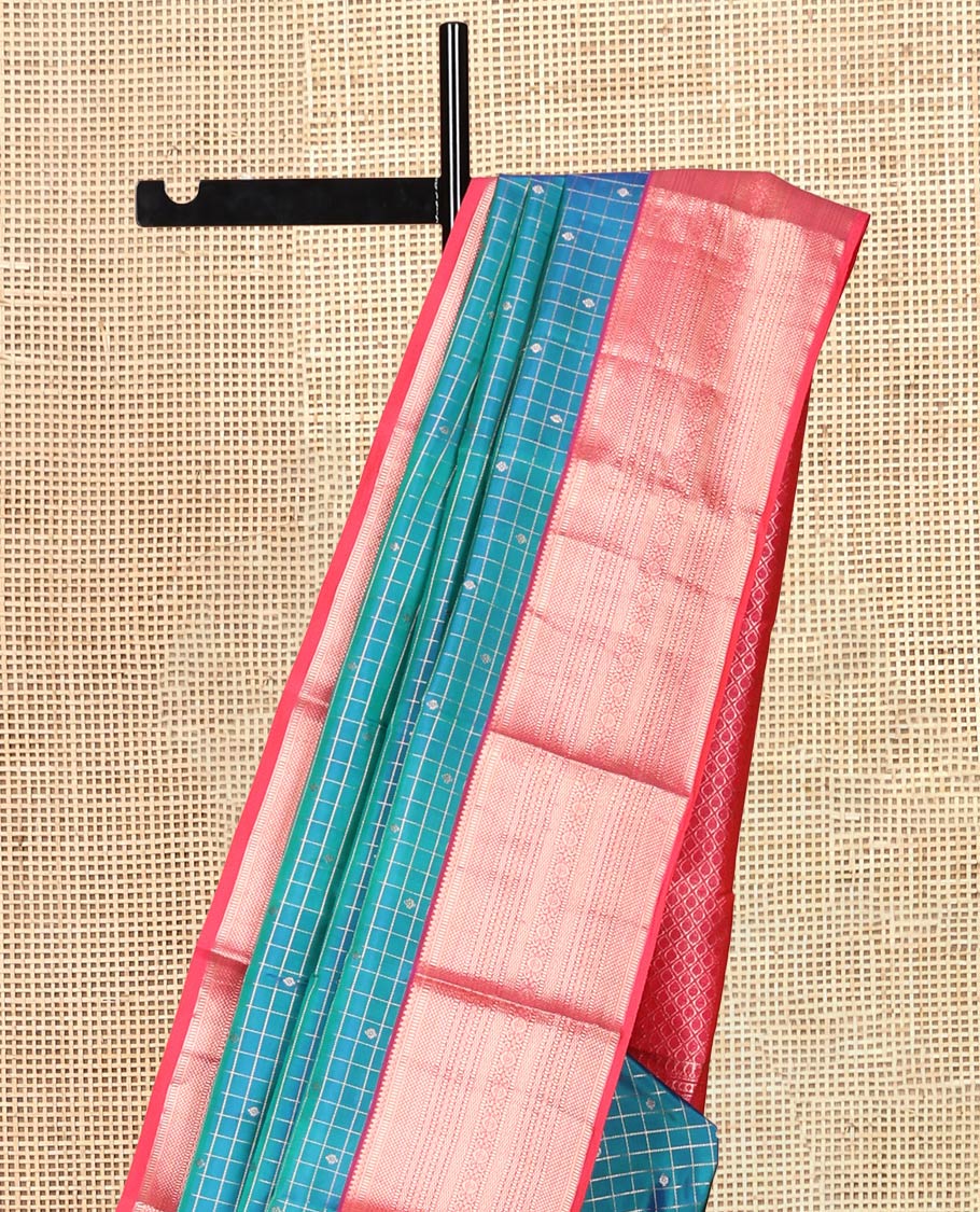 Blue Vasundhara Silk Saree, Featuring Zari Butta Enclosed Checks, a Contrast Border of Thilakam Mokku, Muthu, Mayil Kann, Rettai Neli, and Vanki Designs, Jaal Pallu, and Contrast Blouse