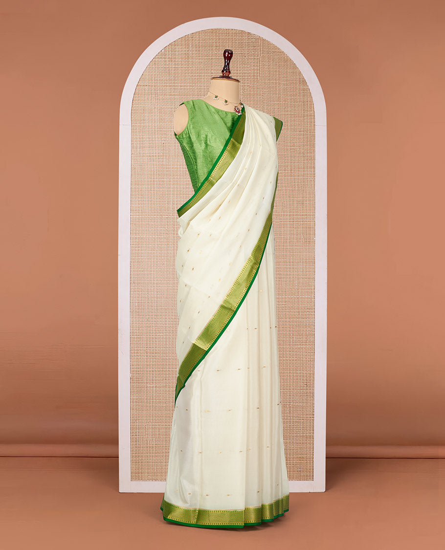 White Mysore Silk Saree, Ornamented with Zari Buttas All Over Its Body, Complemented by a Contrast Traditional Zari Design Border, Zari-Buttas Woven Pallu, and Paired with a Contrast Blouse