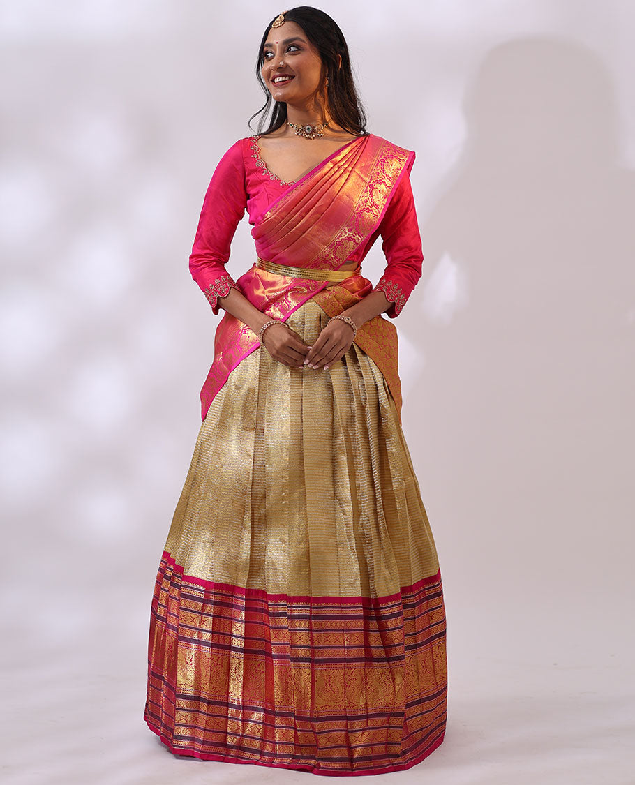 Gold striped silk half saree with contrast intricate zari design, floral embroidery blouse & floral zari design dhavani