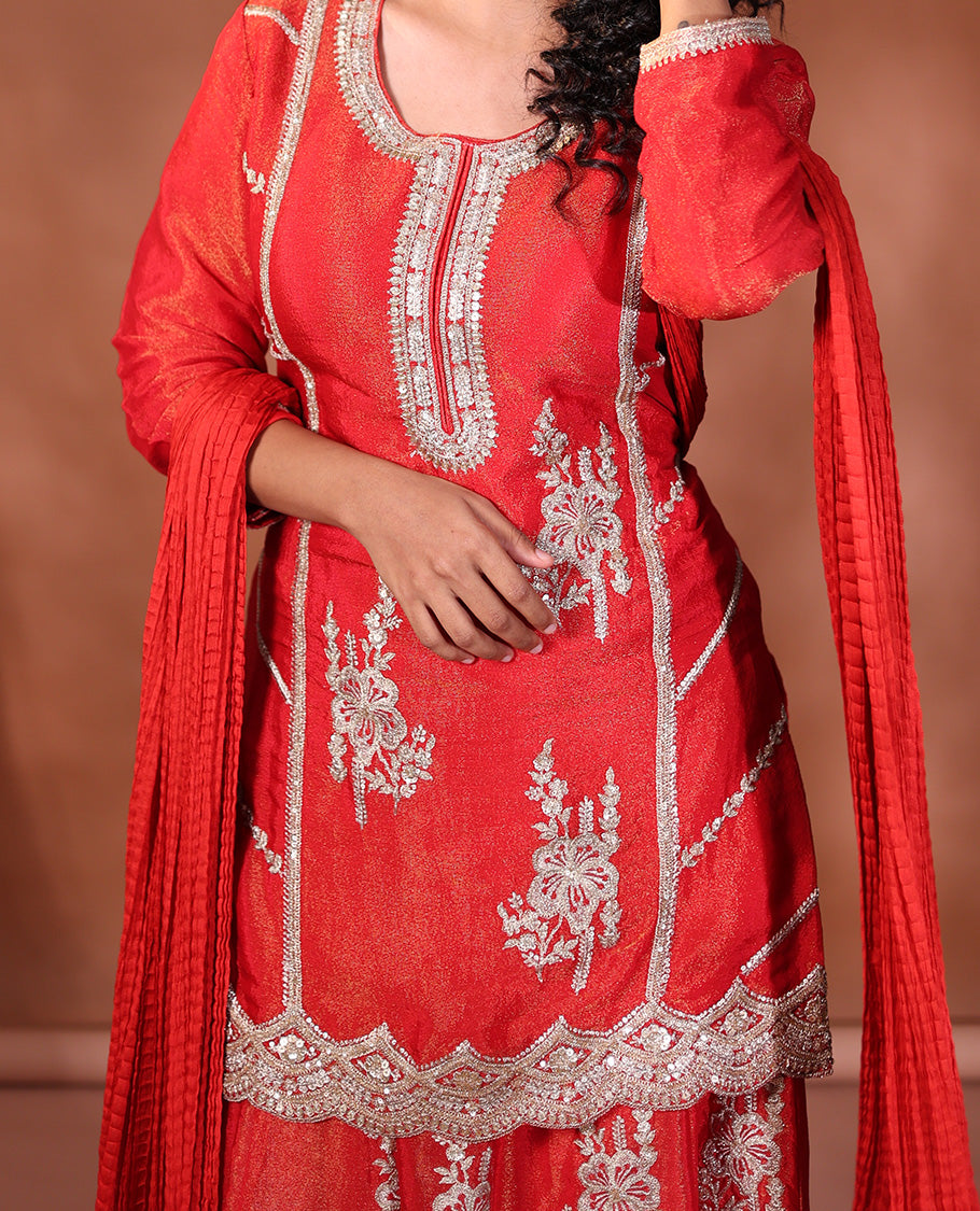 Red Readymade Suit Featuring an Intricately Embroidered Round Neck 3/4th Sleeve Straight-Cut Top, Floral-Embroidered Scallop-Cut Sharara Pants, and a Crushed Dupatta