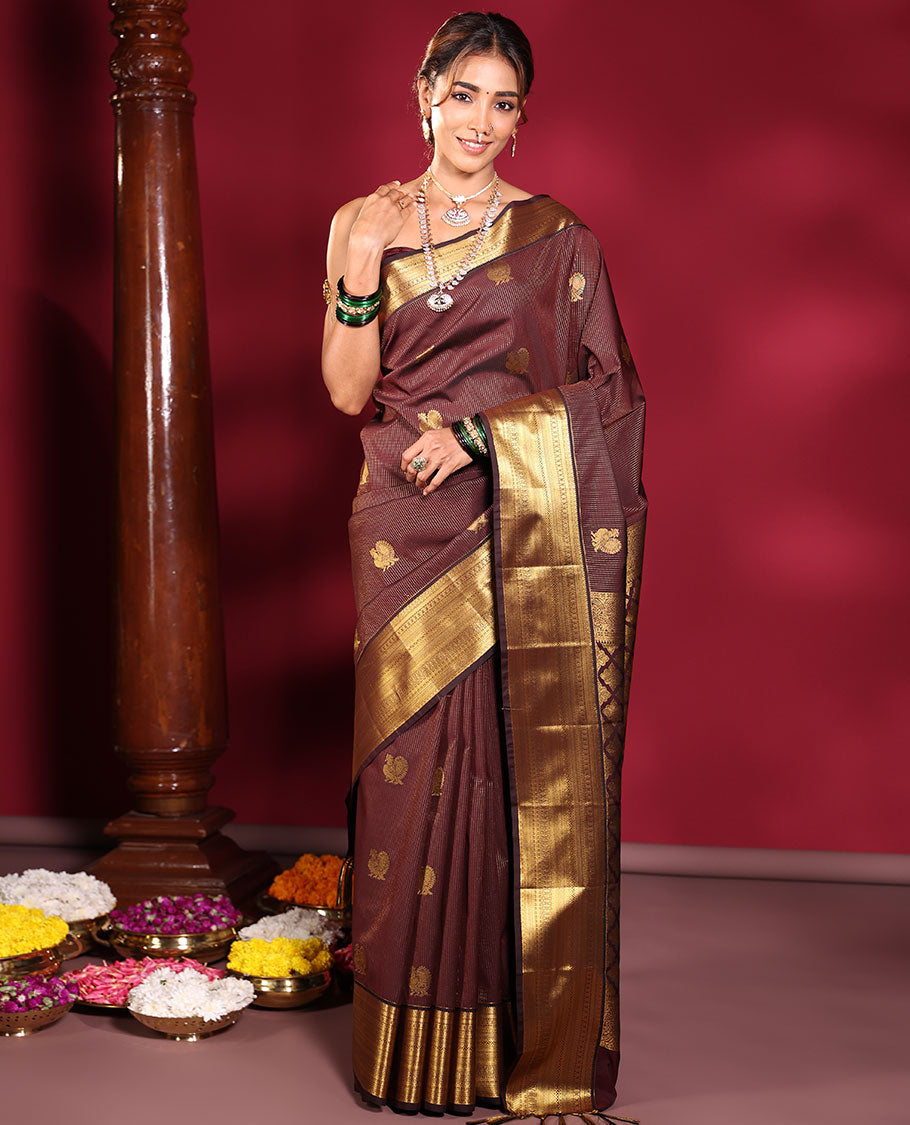 Chocolate Brown Budget Silk Saree, Elevated with Muthu Stripes, and Peacock Buttas on Its Body, Highlighted by a Traditional Zari Design Border, Pallu Delicately Woven with Floral Jaal Designs, and Paired with a Matching Blouse