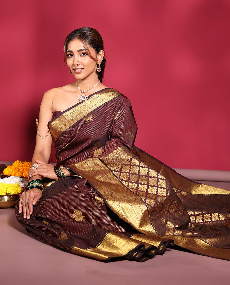 Chocolate Brown Budget Silk Saree, Elevated with Muthu Stripes, and Peacock Buttas on Its Body, Highlighted by a Traditional Zari Design Border, Pallu Delicately Woven with Floral Jaal Designs, and Paired with a Matching Blouse