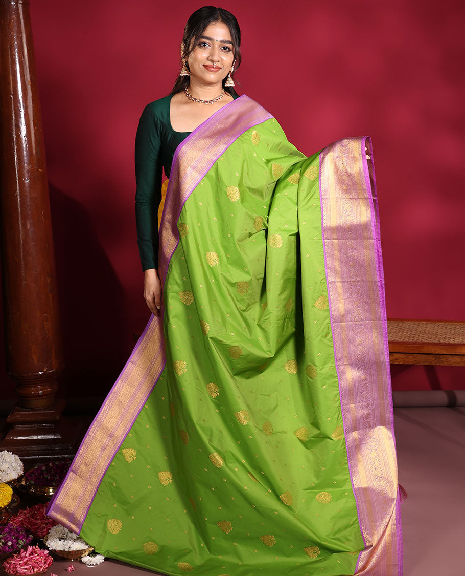 Parrot Green Budget Silk Saree, Embellished with Zari Buttas on Its Body, Complemented by a Contrast Traditional Zari Design Border, Grandly Decked Up Pallu, and Paired with a Contrast Blouse