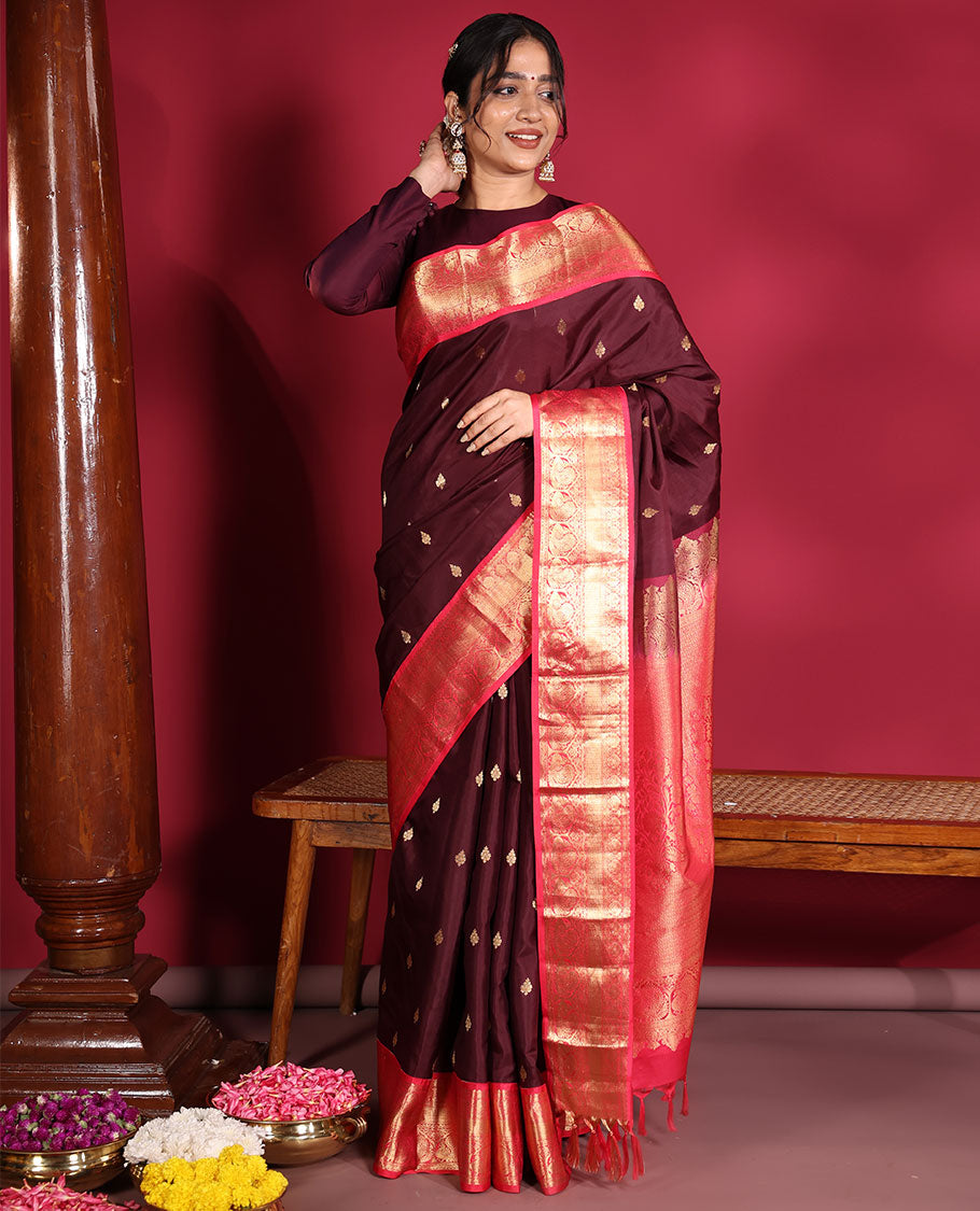 Brown Vasundhara Silk Saree, Decorated with Zari Buttas on Its Body, Complemented by a Contrast Traditional Zari Border of Mayil Designs, Grand Pallu Depicts Jaal and Floral Designs, and Paired with a Contrasting Blouse