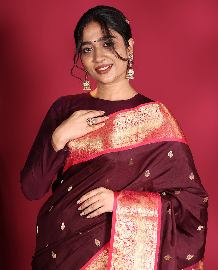 Brown Vasundhara Silk Saree, Decorated with Zari Buttas on Its Body, Complemented by a Contrast Traditional Zari Border of Mayil Designs, Grand Pallu Depicts Jaal and Floral Designs, and Paired with a Contrasting Blouse