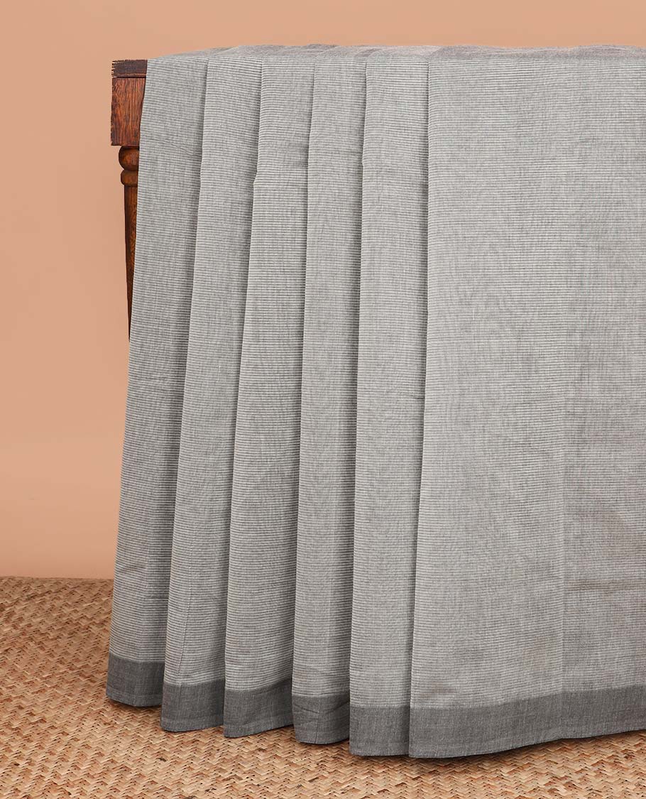 Grey plain Mangalagiri cotton saree, contrast dark grey border, plain pallu, and a contrast kalamkari floral printed blouse