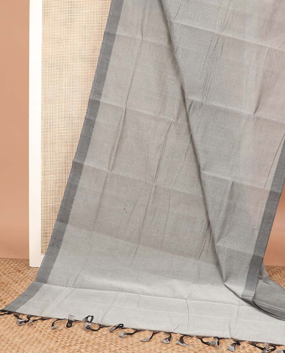 Grey plain Mangalagiri cotton saree, contrast dark grey border, plain pallu, and a contrast kalamkari floral printed blouse