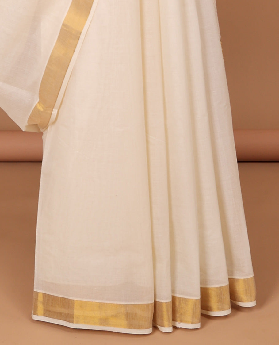 Cream kerala saree with zari stripes, zari border & pallu of floral & paisley designs
