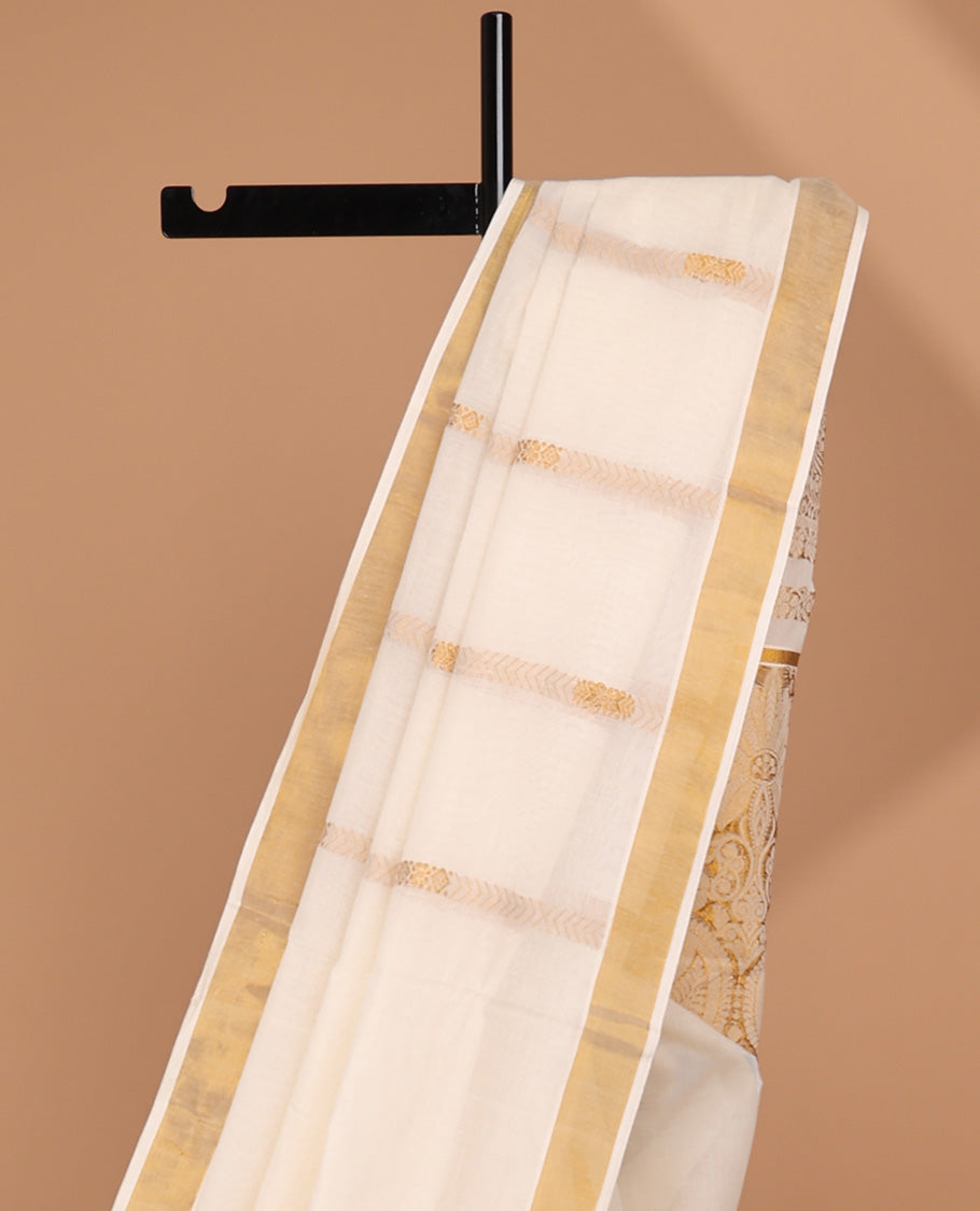Cream kerala saree with zari stripes, zari border & pallu of floral & paisley designs