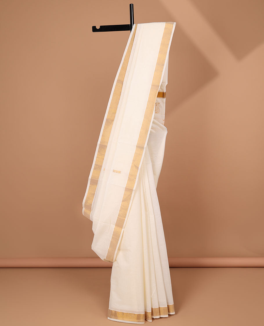 Cream kerala saree, zari border & pallu of peacock zari designs