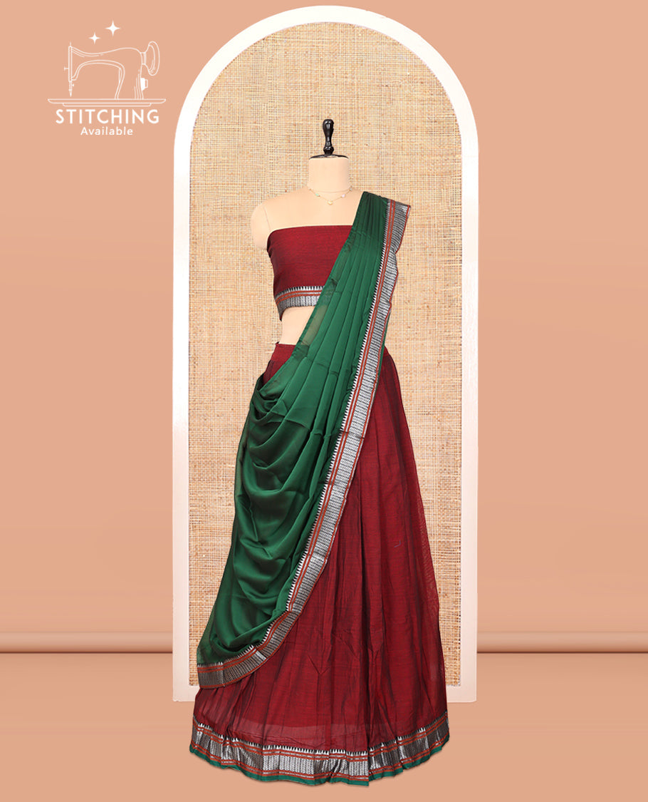 Maroon Cotton Half-Saree Features Plain Skirt, a Contrast Traditional Border, a Matching Blouse, and a Contrast Dhavani