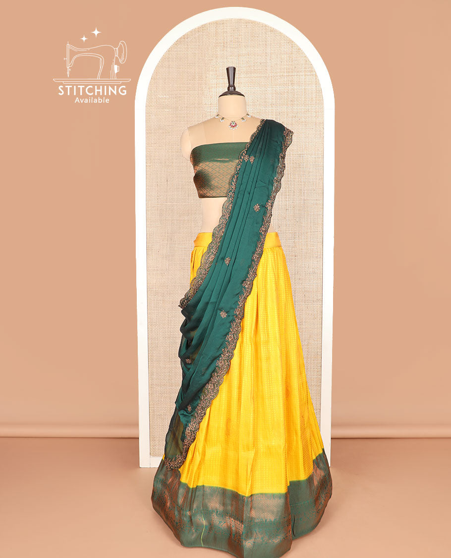 Yellow art silk half-saree, checked with contrast traditional zari bordered skirt, jacquard blouse, and scallop embroidered dhavani