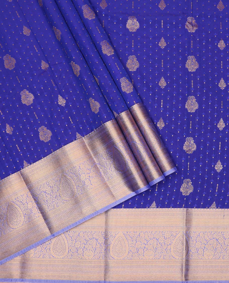 Navy blue art silk pavadai material, embossed with zari buttas woven skirt, contrast traditional zari border, and blouse