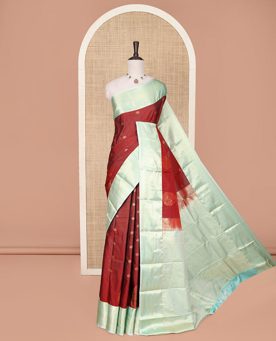 Red Budget Silk Saree, Mesmerized with Zari Buttas and Stripes All Over Its Body, Complemented by a Contrast Traditional Zari Design Border, Sparsely Woven Jaal Pallu, and Paired with a Contrast Blouse