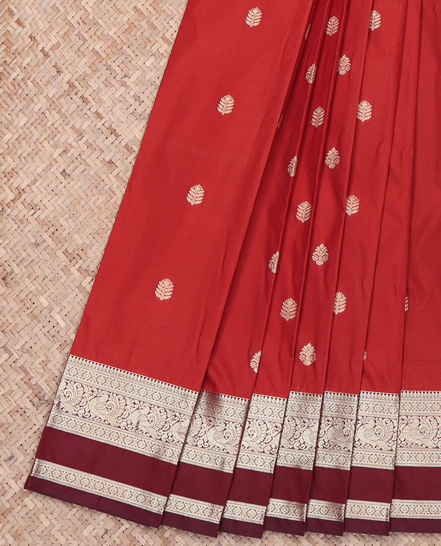 Red Budget Silk Saree, Adorned with Buttas All Over Its Body, Complemented by Contrast Rettai Pettu Traditional Zari Design Border of Peacocks, Jaal Pallu, and Paired with a Contrast Blouse
