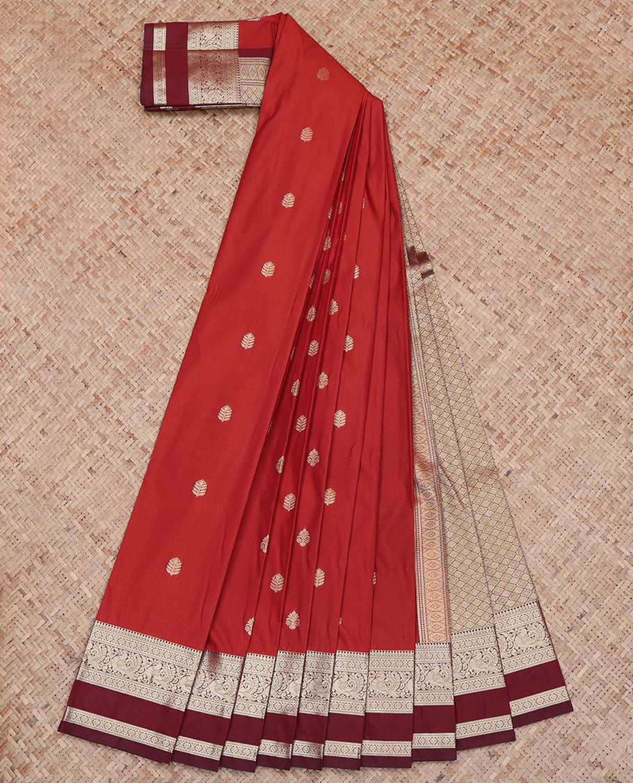 Red Budget Silk Saree, Adorned with Buttas All Over Its Body, Complemented by Contrast Rettai Pettu Traditional Zari Design Border of Peacocks, Jaal Pallu, and Paired with a Contrast Blouse