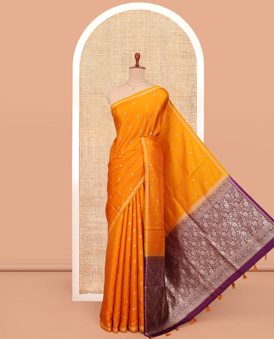 Orange Satin Silk Saree, Subtly Sparkled with Buttas All Over Its Body, a Subtle Piping Border, Complemented by a Contrast Pallu of Floral-Paisley Designs in Zari, and Paired with a Contrast Blouse