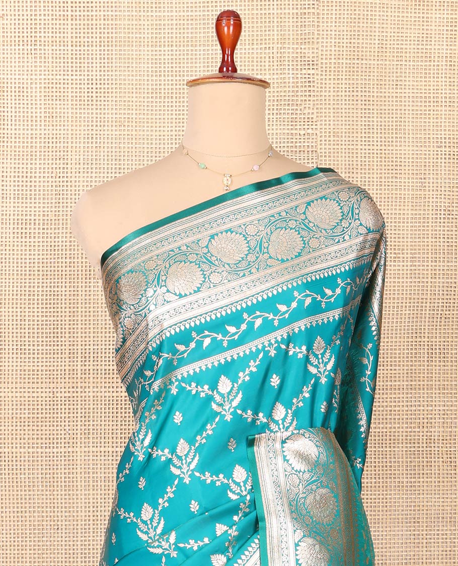Blue Semi-Banaras Saree, Richly Detailed with Jaal Jacquard on Its Body, Highlighted by Floral Creeper Design Border, Intricately Designed Pallu, and Paired with a Contrast Blouse