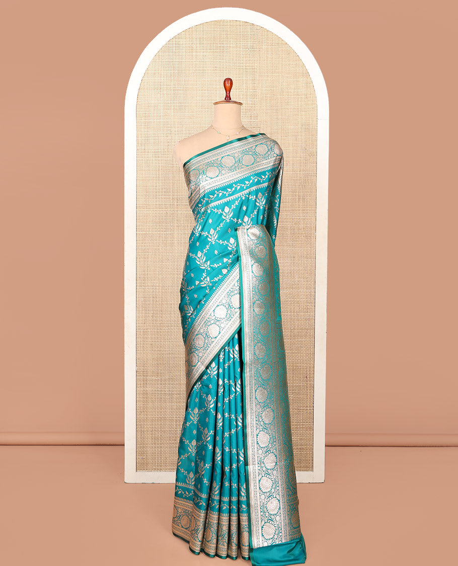 Blue Semi-Banaras Saree, Richly Detailed with Jaal Jacquard on Its Body, Highlighted by Floral Creeper Design Border, Intricately Designed Pallu, and Paired with a Contrast Blouse