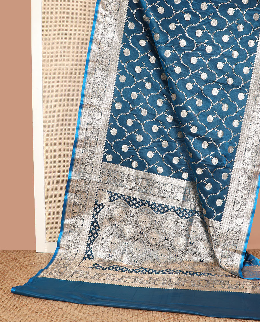 Blue floral jaal jacquard banarasi silk saree, floral creeper design border, and intricate ogee patterned pallu