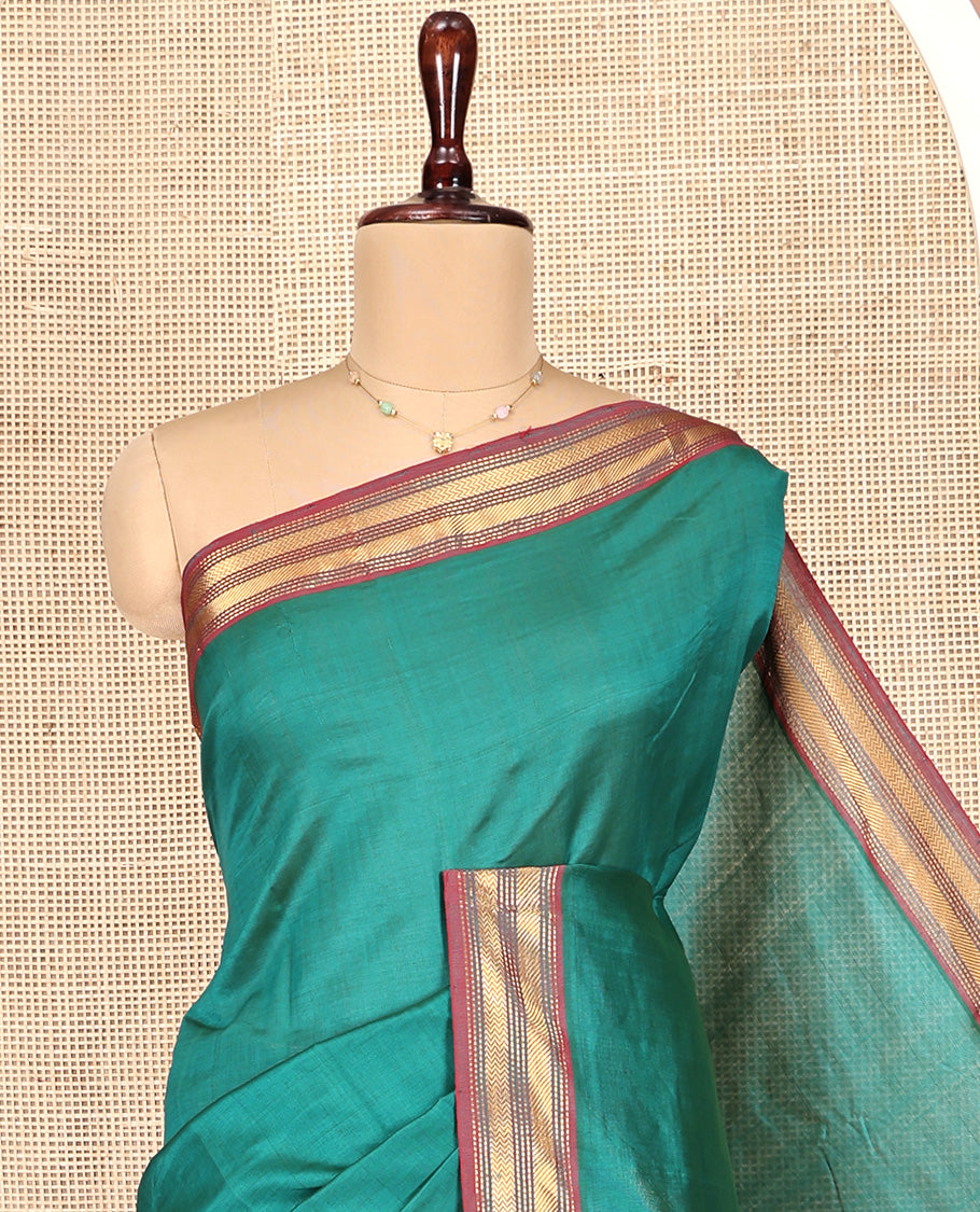 Green Plain Poly Cotton Saree, Complemented by Contrast Traditional Zari Border, Vibrant Striped Pallu, and Paired with a Contrast Blouse