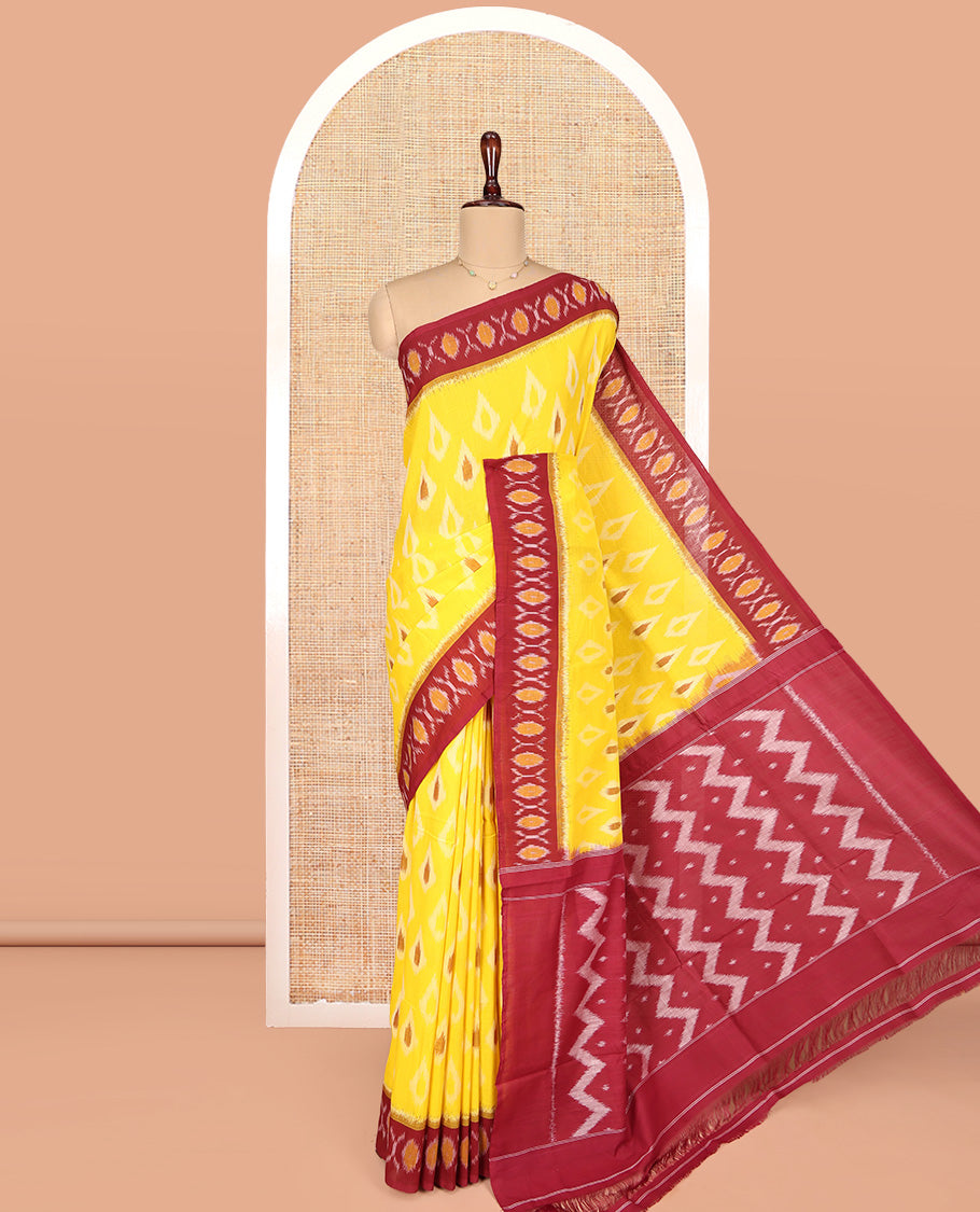 Yellow Ikkat Cotton Saree, Adorned with Ikkat Buttas All Over Its Body, Complemented by a Contrast Border of Ikkat Buttas, Chevron Striped Pallu, and Has No Blouse