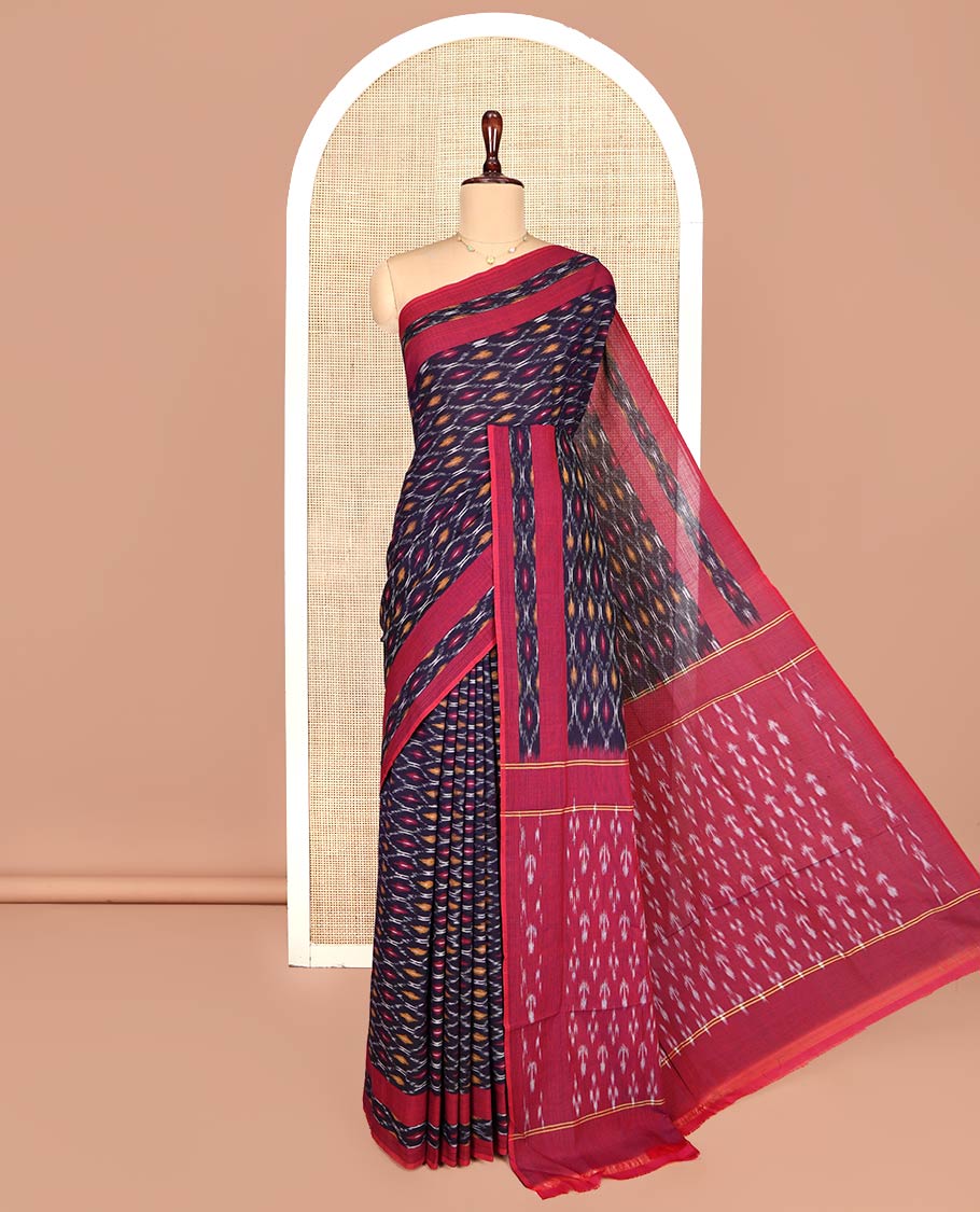 Blue Ikkat Cotton Saree, Adorned with Ikkat-Style Ogee Patterns on Its Body, Complemented by Contrast Ikkat-Style Border, Pallu Steeped with Ikkat Buttas, and Has No Blouse