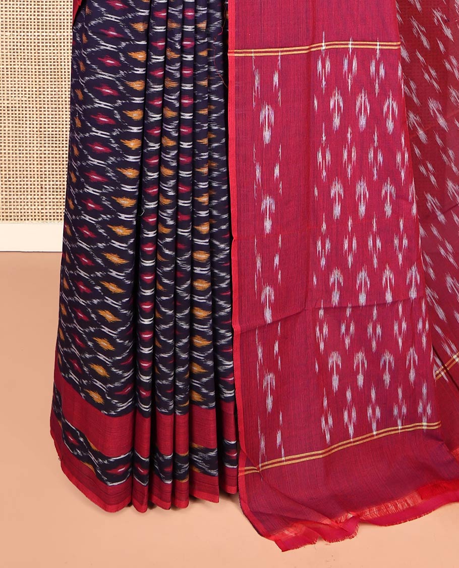 Blue Ikkat Cotton Saree, Adorned with Ikkat-Style Ogee Patterns on Its Body, Complemented by Contrast Ikkat-Style Border, Pallu Steeped with Ikkat Buttas, and Has No Blouse