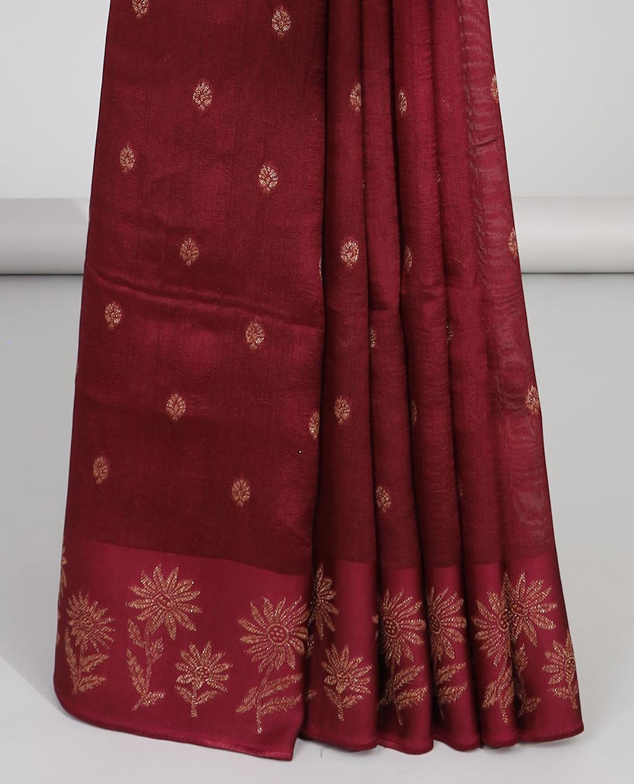 Maroon floral buttas dola silk saree with self floral design border & intricate zari design pallu