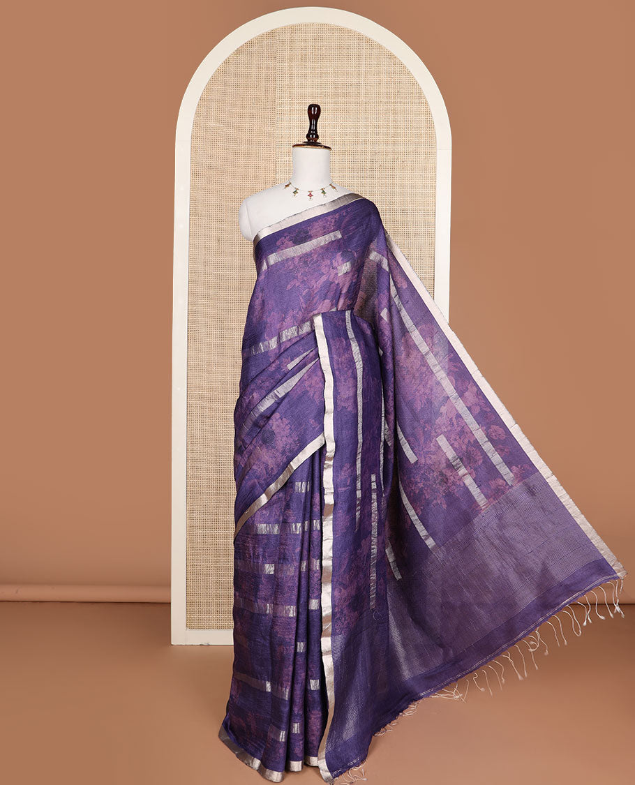 Blue silhouette style floral printed with silver zari striped tussar saree, piping zari border, and zari rich pallu