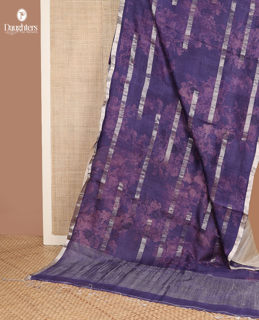 Blue silhouette style floral printed with silver zari striped tussar saree, piping zari border, and zari rich pallu